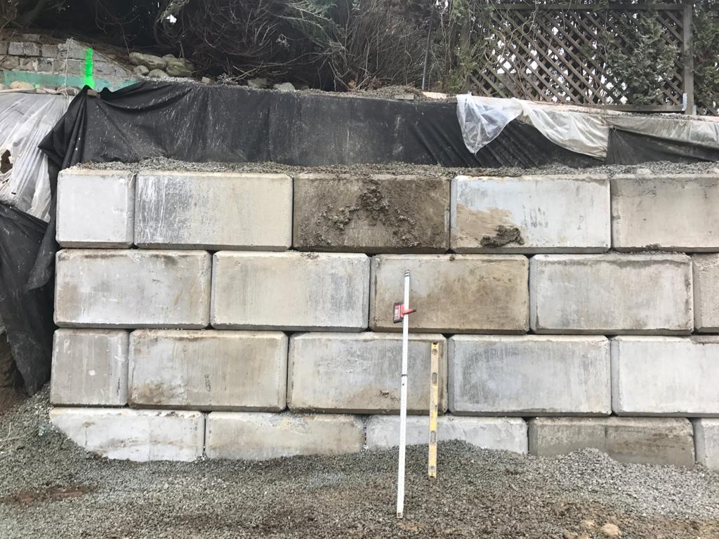 A concrete block retaining wall